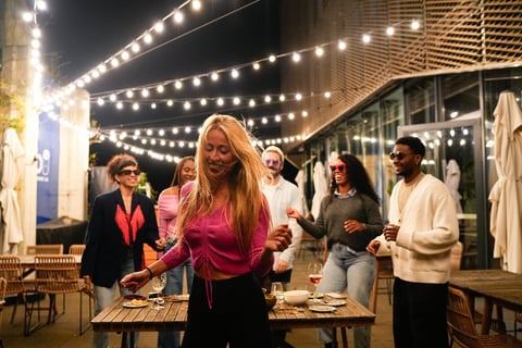 Rooftop social gathering with city skyline