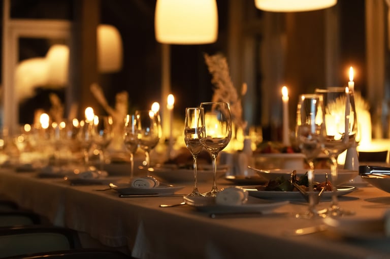Beautifully arranged candlelit dinner table for sophisticated gathering