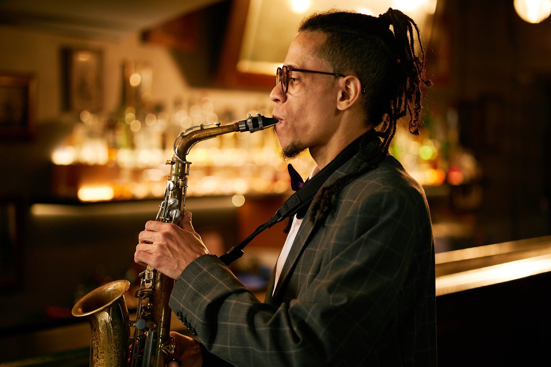 Live jazz saxophonist performing soulful music in intimate lounge