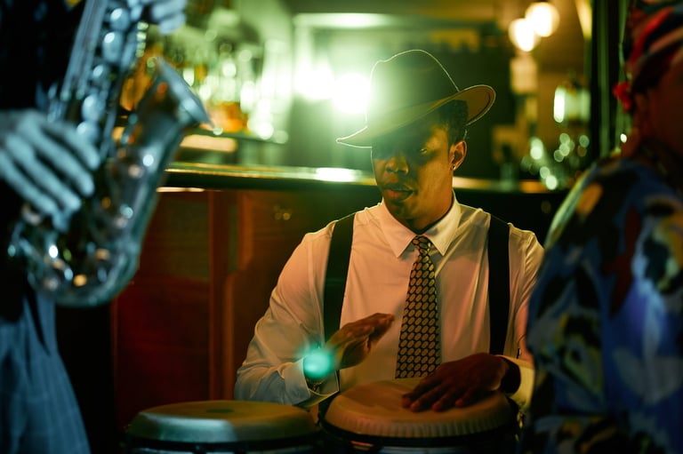 Drummer bringing rhythm to jazz ensemble under neon lights