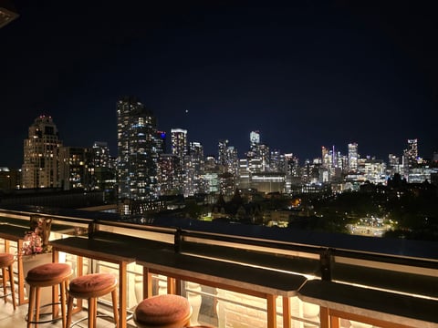 City skyline from elegant rooftop lounge at night